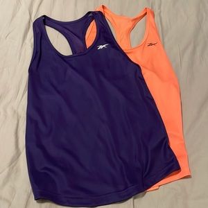 2 Reebok tanks